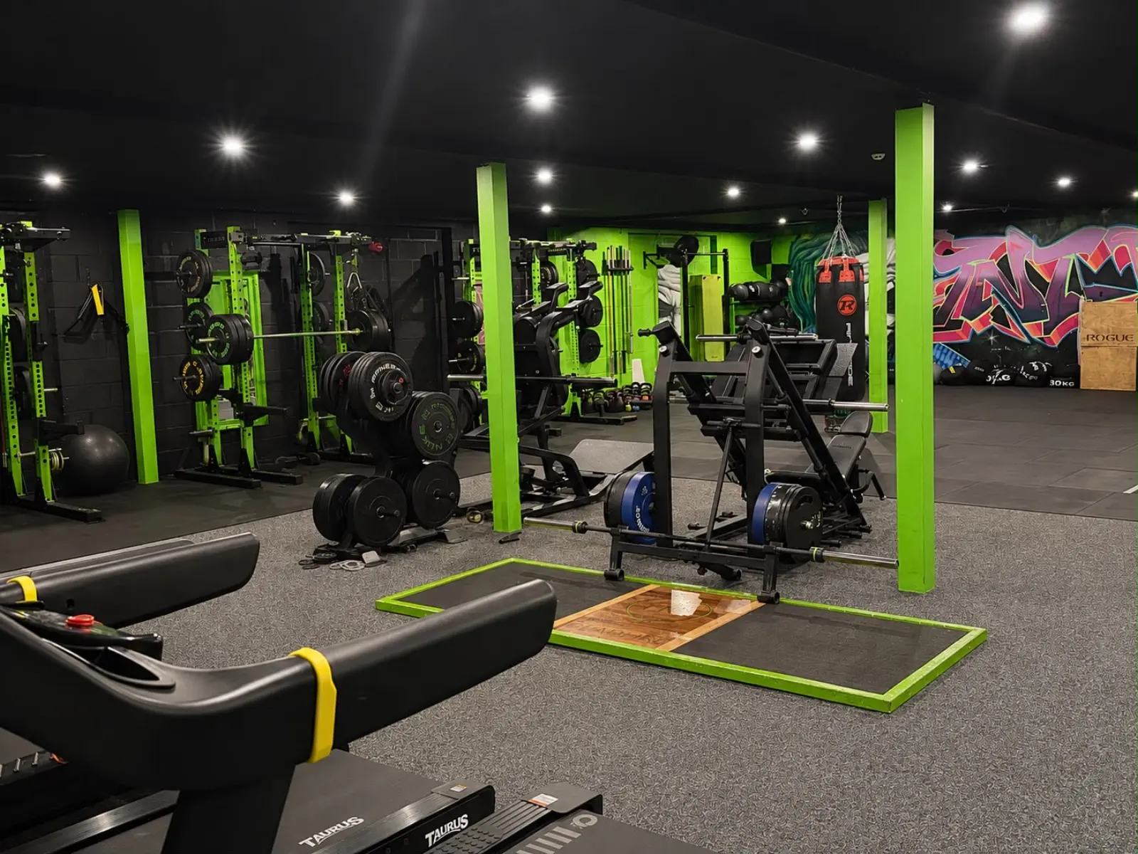 Power racks, barbells and lifting platform in the TNT Fitness strength room