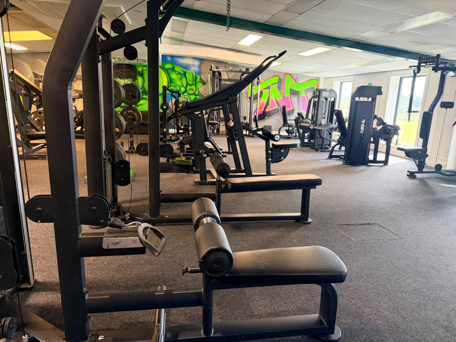 Cable machines, benches and resistance equipment on the main gym floor